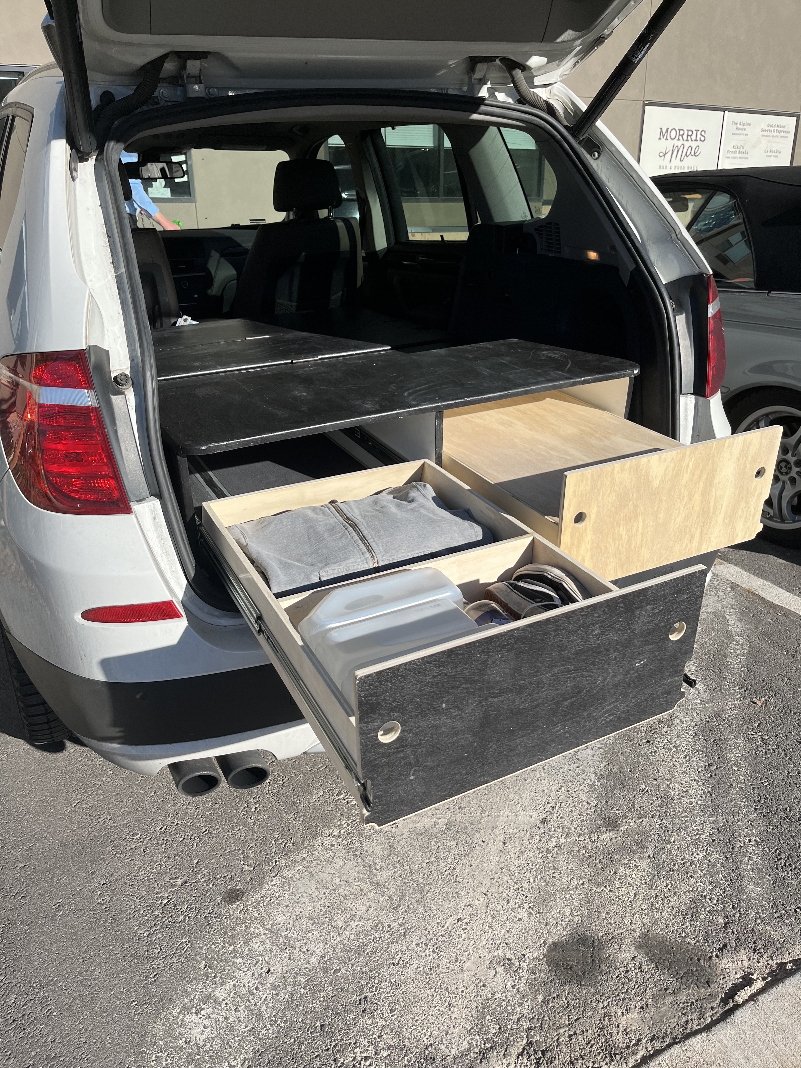 Two large compartments in the left drawer